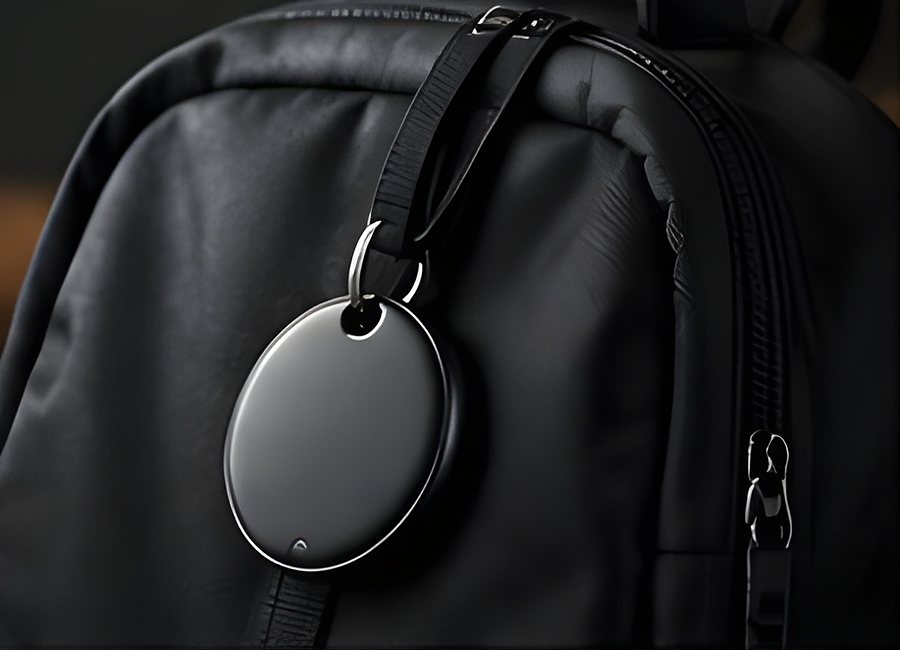 TECHSAFE Tag hanging from the zip pull of a black backpack.